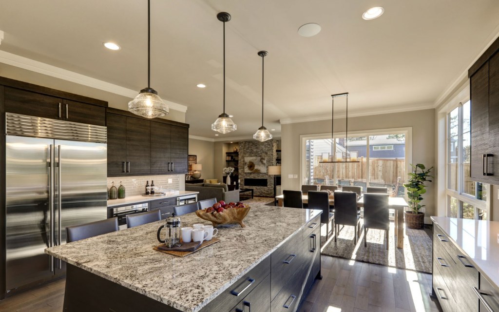 Modern gray kitchen with white quartz counter tops