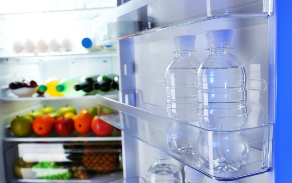 Transparent water bottles in refrigerator