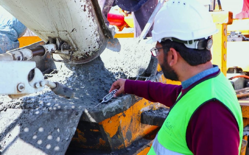 A worker conducts site tests